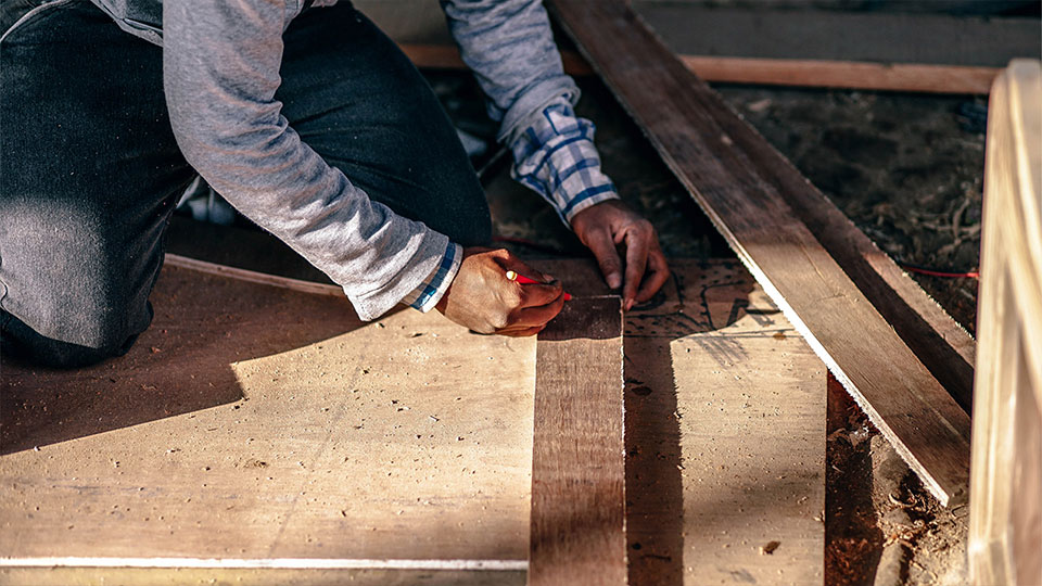 Man measuring boards