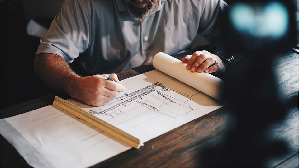 Man studying blueprints